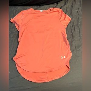 Under armor coral athletic shirt. Never worn, but does not have the tags on.